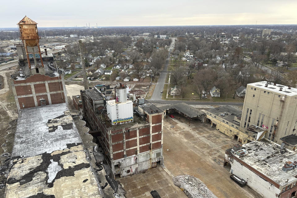 The view from high in the head house of the former Pillsbury Mills plant in Springfield, Ill., Nov. 30, 2023, shows the vast expanse of vacant factory that the nonprofit organization Moving Pillsbury Forward has pledged to demolish followed by redevelopment of the site. The organization needs approval from the Federal Aviation Authority, among other federal agencies, to raze the site because the head house, the city's third-largest structure, encroaches by several feet into airspace of Abraham Lincoln Capital Airport. (AP Photo/John O'Connor)