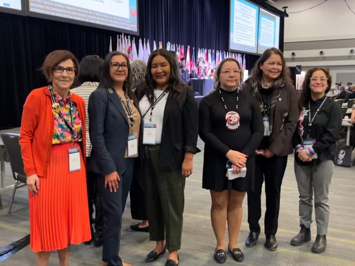 From left to right, child-welfare advocate Cindy Blackstock stands with lead plaintiffs Melissa Walterson, Karen Osachoff, Manitoba Regional Chief Cindy Woodhouse and lead plaintiffs Carolyn Buffalo and Ashley Bach in Ottawa. (Brett Forester/CBC - image credit)