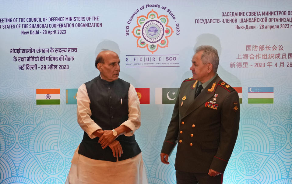 Indian Defense Minister Rajnath Singh speaks with his Russian counterpart Sergei Shoigu, right, before the start of the defence ministers meeting for the Shanghai Cooperation Organisation (SCO) summit in New Delhi, India, Friday, April 28, 2023. (AP Photo/Manish Swarup)