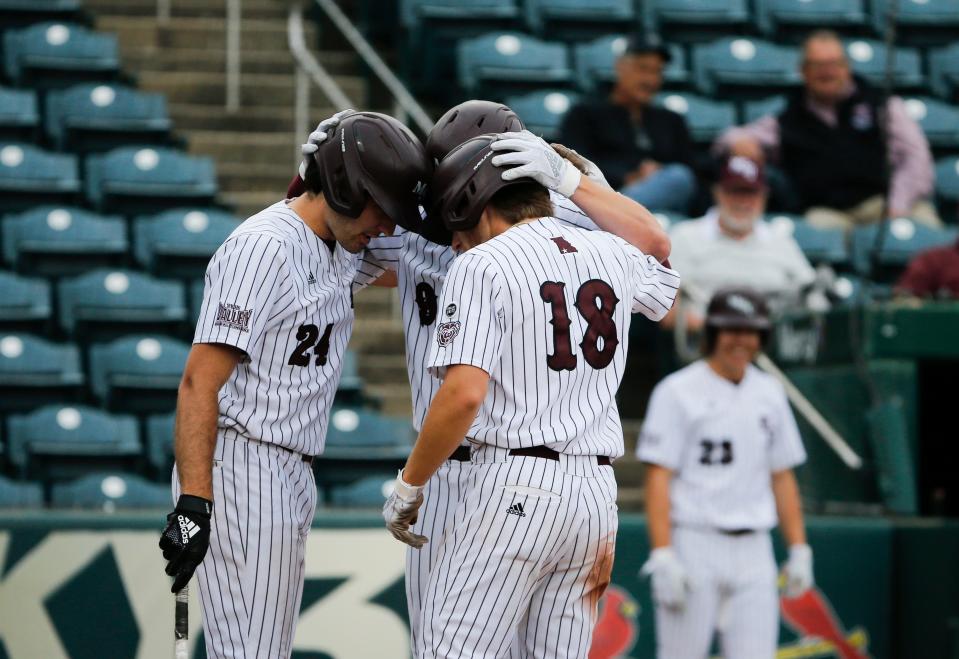 Missouri State baseball players celebrate at the plate after Zack Stewart hit a home run on the Belmont Bruins at Hammons Field on Thursday, April 20, 2023.