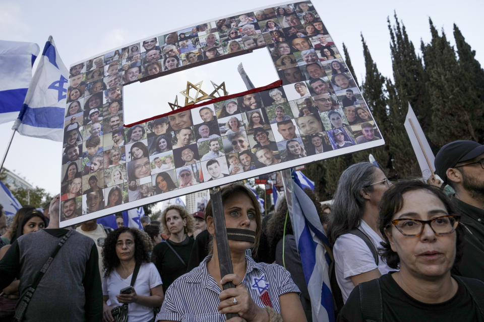 Family and supporters of the estimated 240 hostages held by Hamas in Gaza complete the final leg of a five-day solidarity rally calling for their return, from Tel Aviv to the Prime Minister's office in Jerusalem, Saturday, Nov. 18, 2023. The hostages, mostly Israeli citizens, were abducted during the brutal Oct. 7 Hamas cross-border attack in Israel and have been held in the enclave since as war rages. (AP Photo/Mahmoud Illean)