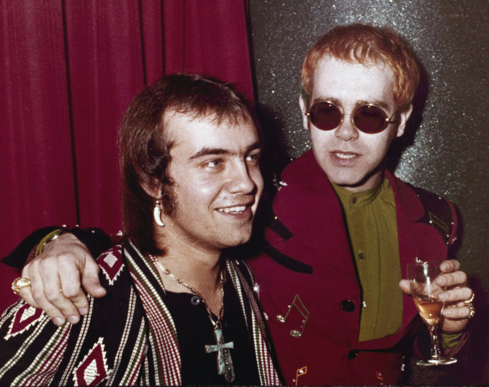 FILE - British pop idol Elton John appears with his lyricist Bernie Taupin in London on March 5, 1973. Taupin's memoir, "Scattershot: Life, Music, Elton, and Me" releases this week. (AP Photo/John Glanvill, File)