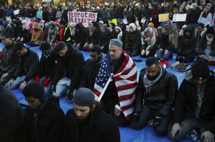 Rutgers University students and supporters gather for Muslim prayer