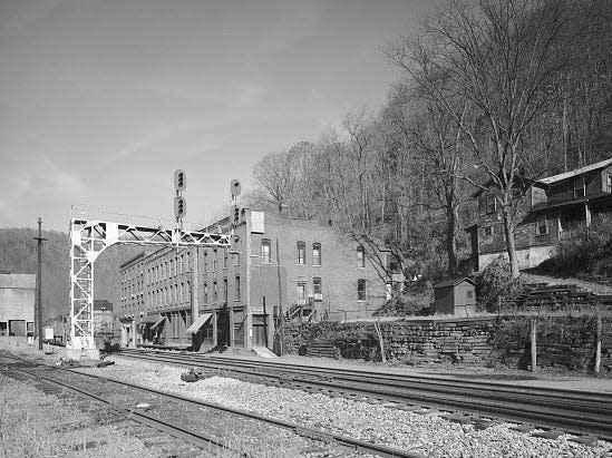 black and white photo of the railroad tracks and station in Thurmond, West Virginia