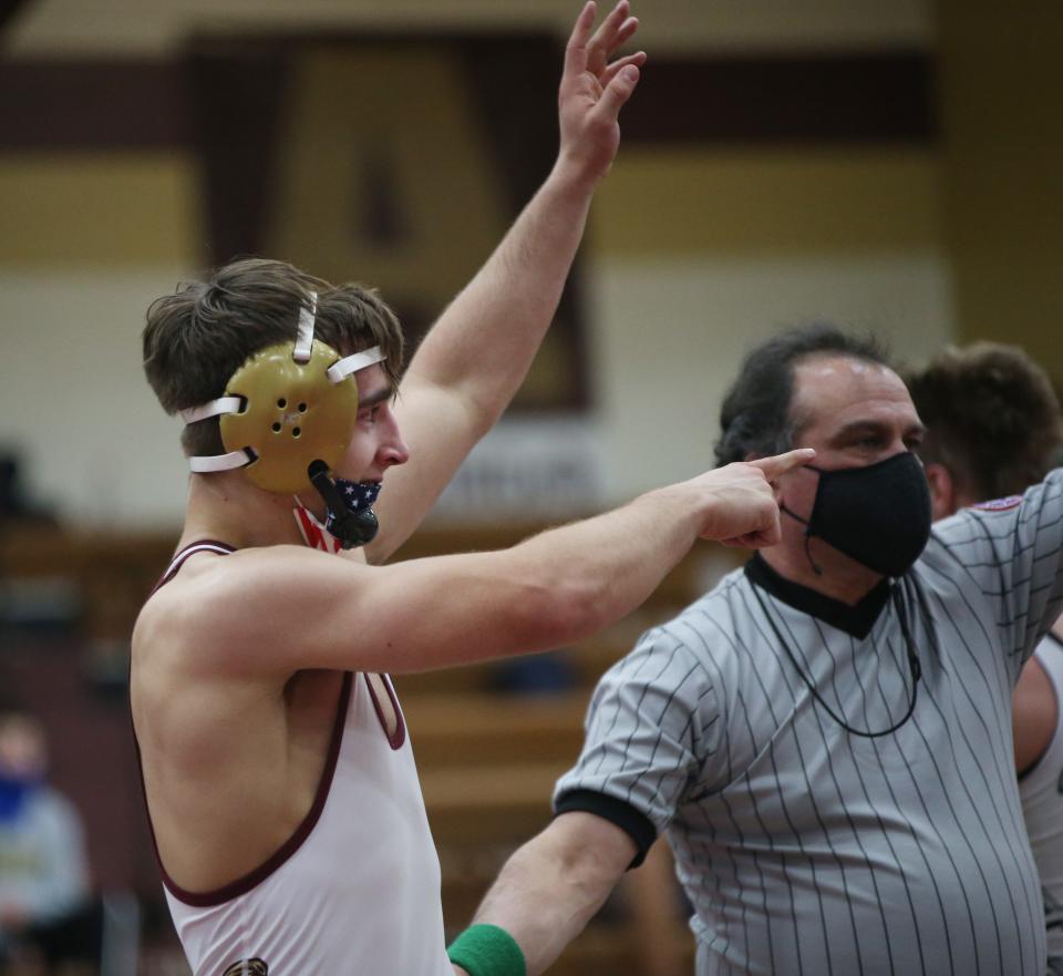 Arlington's Tim Bova celebrates his win over Xavier's Colin Loria in the championship match for the 152lb weight class during the Mid Hudson Wrestling Tournament in Freedom Plains on December 28, 2021. 