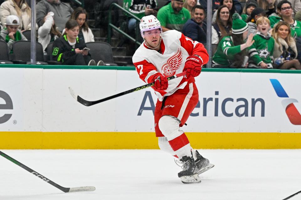 Dec 11, 2023; Dallas, Texas, USA; Detroit Red Wings right wing Daniel Sprong (17) passes the puck against the Dallas Stars during the first period at the American Airlines Center. Mandatory Credit: Jerome Miron-USA TODAY Sports