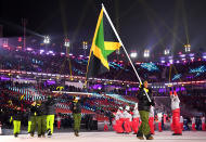 <p>Flag bearer Audra Segree of Jamaica and teammates arrive during the Opening Ceremony of the PyeongChang 2018 Winter Olympic Games at PyeongChang Olympic Stadium on February 9, 2018 in Pyeongchang-gun, South Korea. (Photo by Matthias Hangst/Getty Images) </p>