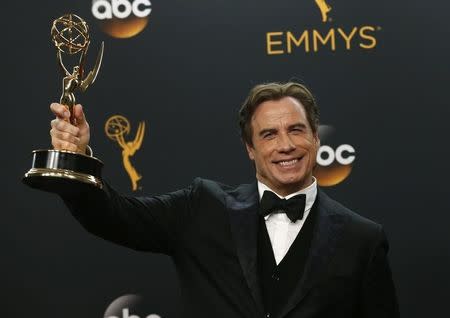 Actor John Travolta poses backstage with the award for Outstanding Limited Series for FX Network's "The People v. O.J. Simpson: American Crime Story" at the 68th Primetime Emmy Awards in Los Angeles, California U.S., September 18, 2016. REUTERS/Mario Anzuoni