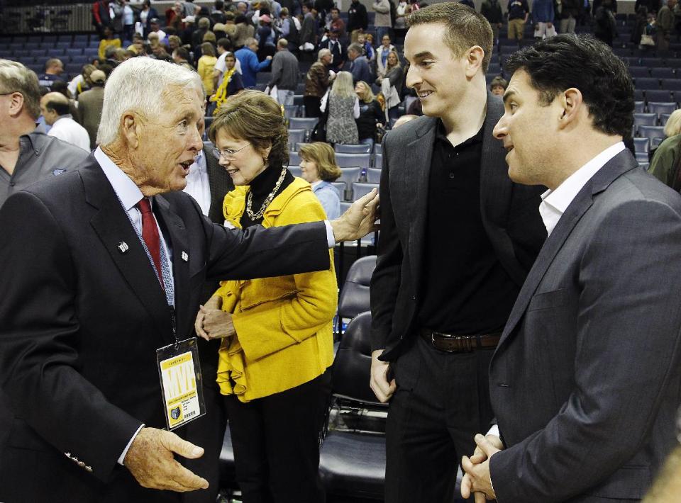 Former Memphis Grizzlies majority owner Michael Heisley, left, greets new Grizzlies chairman Robert J. Pera, center, and new CEO Jason Levien following an NBA basketball game between the Grizzlies and the Utah Jazz, Monday, Nov. 5, 2012, in Memphis, Tenn. The Grizzlies won 103-94. (AP Photo/Lance Murphey)