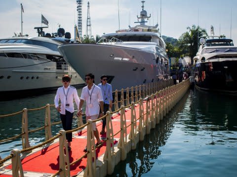 men viewing yachts