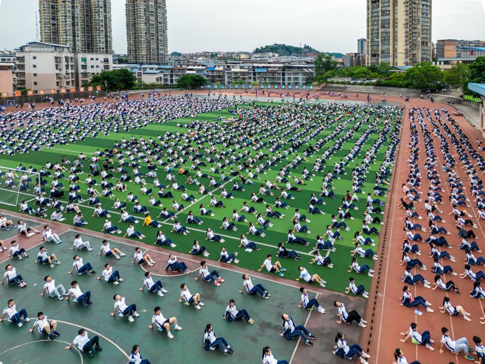 Senior students practice yoga to relieve their stress before the National College Entrance Examination (aka Gaokao) at a middle school on June 1, 2023 in Anyue County, Ziyang City, Sichuan Province of China.