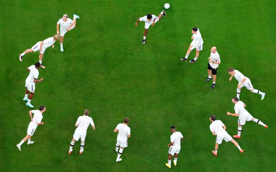 German players warm-up before the World Cup group E match - AP