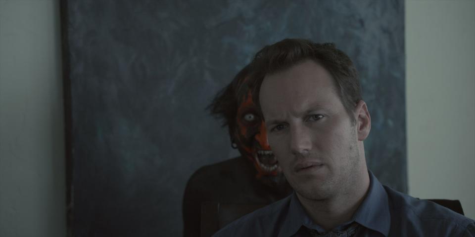 Josh Lambert (Patrick Wilson, right) is haunted by the Lipstick Face Demon (Joseph Bishara) in "Insidious."