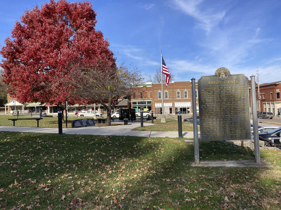 This plaque erected by the State Historical Society of Missouri is shown in Hartville, Mo., on Tuesday, Nov. 16, 2021. The U.S. Census Bureau on Tuesday, announced that Hartville is the closest town to the middle of the nation. The hamlet of about 600 people in the Missouri Ozarks is located about 15 miles from the center of the U.S. population distribution, according to the Census Bureau. (AP Photo/Summer Ballentine)