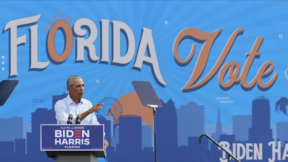 Former President Barack Obama speaks at a rally while campaigning for Democratic presidential candidate former Vice President Joe Biden Tuesday, Oct. 27, 2020, in Orlando, Fla. (AP Photo/John Raoux)