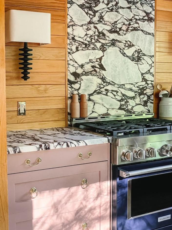 Soft hues, like pink cabinets, can add an unexpected twist, like this Skipp project for designer Kate Arends.