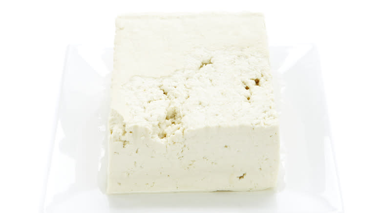 block of tofu on white plate