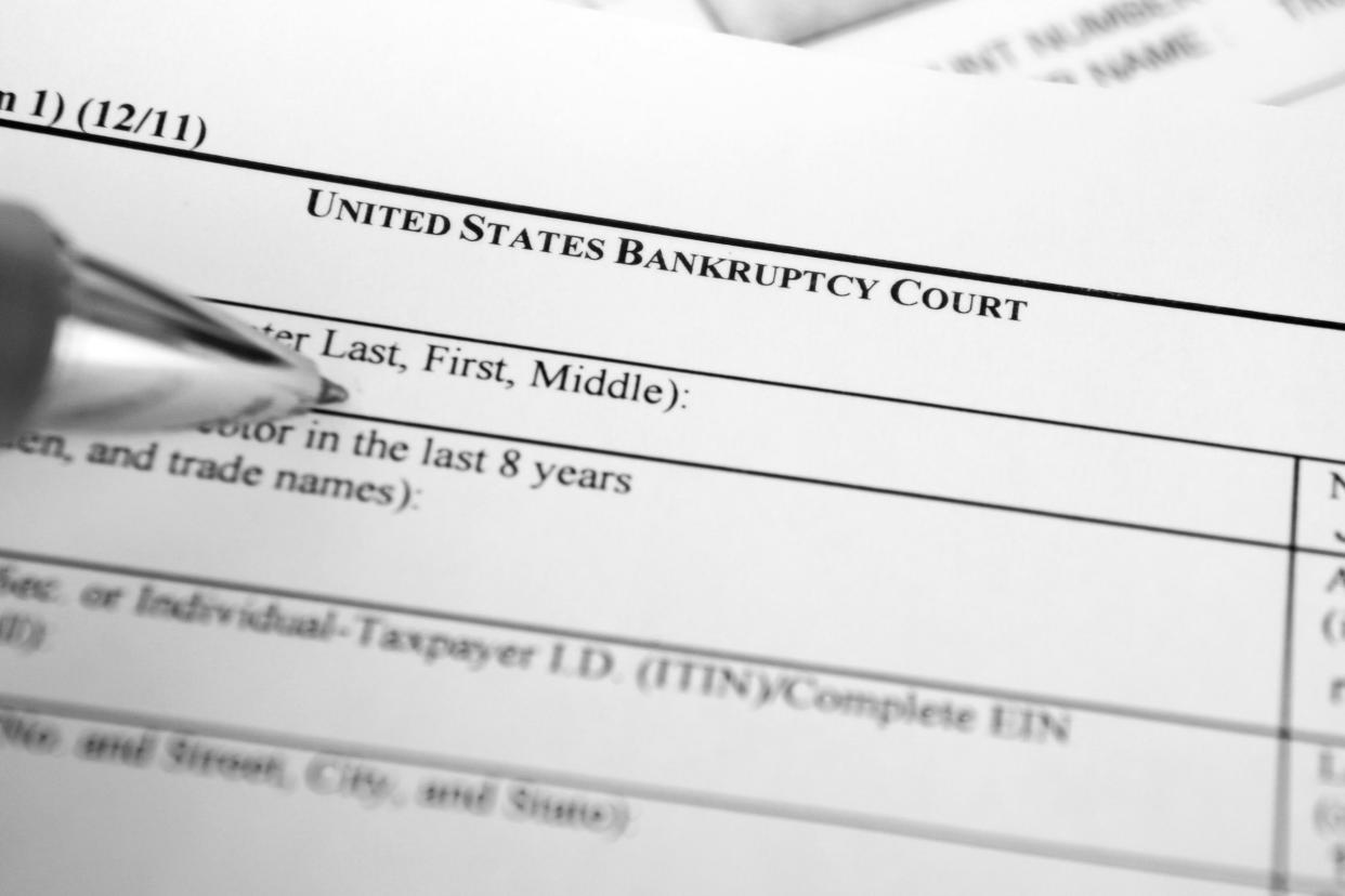bankruptcy filing form with pen