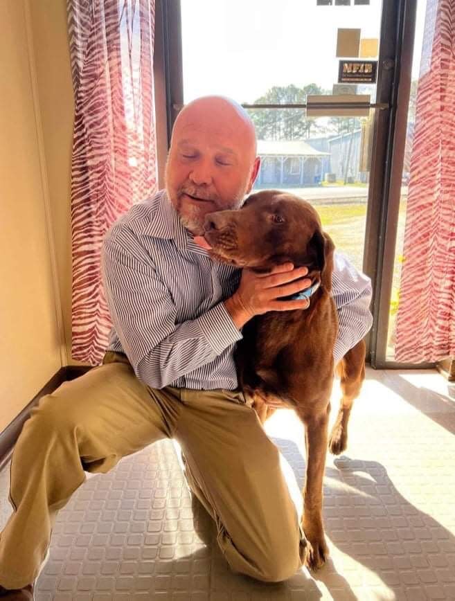 Fisher — the dog rescued by a group of dedicated volunteers Sunday after he was spotted Saturday with a jug stuck on his head — has been reunited with his owner, Patrick Stallings. The dog had been missing since Dec. 20.