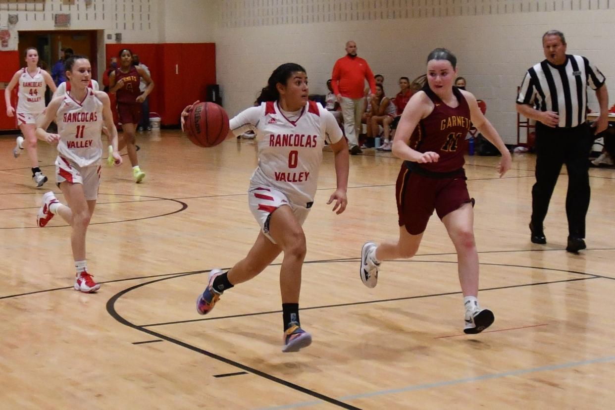 Rancocas Valley senior Adriana Agosto drives into the lane against Haddon Heights forward Maggie Campbell