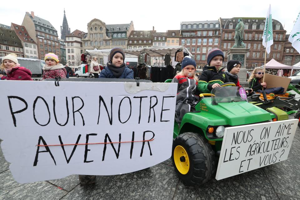 A placard reading "For our future" is seen as farmers' children support their parents in Strasbourg, France, on January 31, 2024, as part of national demonstrations organized by several farmers' unions.