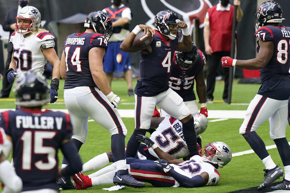 Houston Texans quarterback Deshaun Watson (4) flexes as he celebrates scoring a touchdown against the New England Patriots during the first half of an NFL football game, Sunday, Nov. 22, 2020, in Houston. (AP Photo/David J. Phillip)