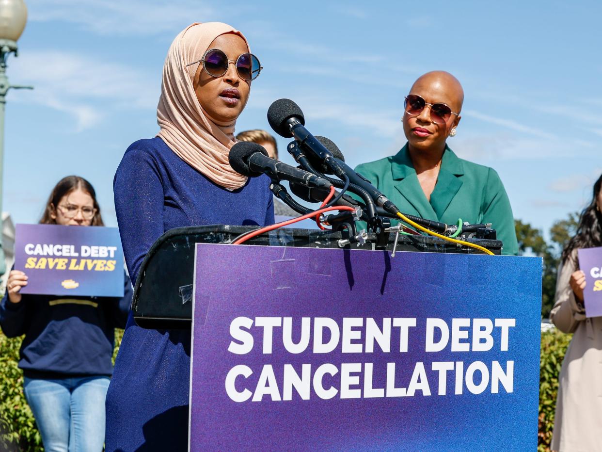 Reps. Ilhan Omar and Ayanna Pressley speak during student debt cancellation press conference.