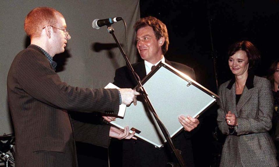 Then Labour leader Tony Blair receives a platinum disc of Oasis’s album ‘What’s The Story, Morning Glory’ from Alan McGhee of Creation Records in 1997.