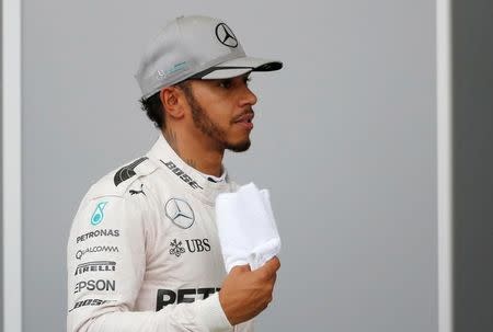 Mercedes' Lewis Hamilton of Britain after the qualifying session. REUTERS/Toru Hanai