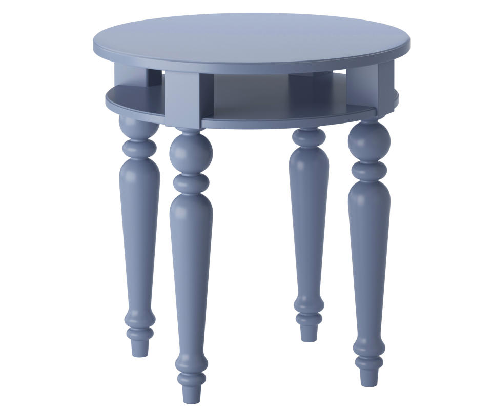 This publicity product photo provided by Ikea (www.ikea.com) shows a blue isala table. When King Gustav III visited France he brought back impressions of Neoclassical style. This Isala table is an example of how the style was interpreted with elegant restraint. (AP Photo/Ikea)