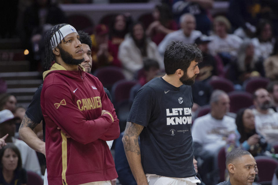 Cleveland Cavaliers' Lamar Stevens, left, and Ricky Rubio stand near the bench as Game 5 of the team's NBA basketball first-round playoff series against the New York Knicks winds down Wednesday, April 26, 2023, in Cleveland. The Knicks won 106-95 and took the series. (AP Photo/Phil Long)
