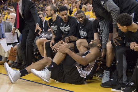 May 14, 2017; Oakland, CA, USA; San Antonio Spurs forward Kawhi Leonard (2) reacts after an injury during the third quarter in game one of the Western conference finals of the 2017 NBA Playoffs against the Golden State Warriors at Oracle Arena. Mandatory Credit: Kyle Terada-USA TODAY Sports