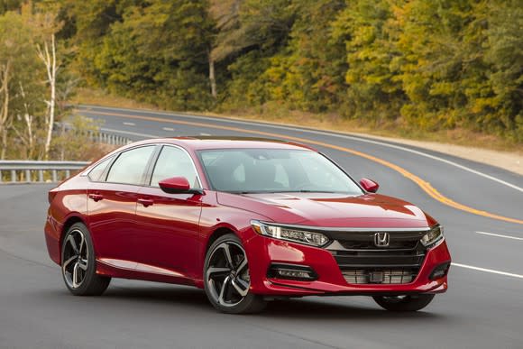 A red 2018 Honda Accord Sport, a midsize four-door sedan with a swooping roofline