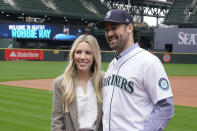 Seattle Mariners pitcher Robbie Ray and his wife Taylor pose for a photo at T-Mobile Park, Wednesday, Dec. 1, 2021, following a news conference in Seattle. The AL Cy Young Award winner — who previously pitched for the Toronto Blue Jays — signed a five-year contract with the Mariners. (AP Photo/Ted S. Warren)