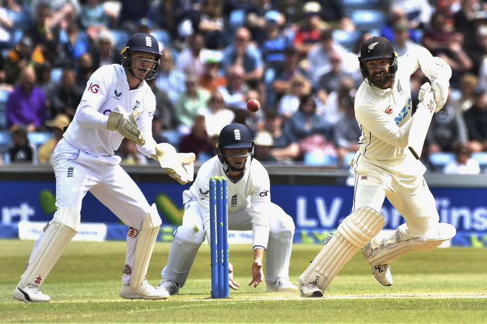 New Zealand's Tom Blundell, right, plays a shot during the fourth day of the third cricket test match between England and New Zealand at Headingley in Leeds, England, Sunday, June 26, 2022. (AP Photo/Rui Vieira)