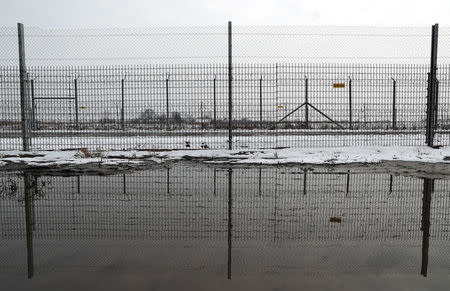 The wire border fence stands next to the village of Asotthalom, Hungary, March 20, 2018. REUTERS/Bernadett Szabo