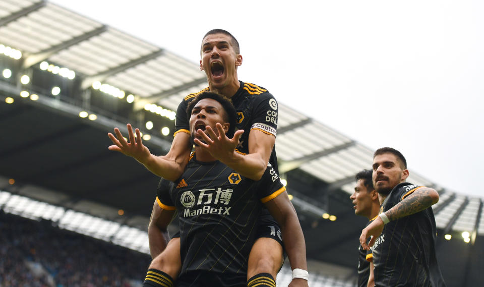 MANCHESTER, ENGLAND - OCTOBER 06: Adama Traore of Wolverhampton Wanderers celebrates after scoring a goal to make it 0-1 with Conor Coady of Wolverhampton Wanderers during the Premier League match between Manchester City and Wolverhampton Wanderers at Etihad Stadium on October 6, 2019 in Manchester, United Kingdom. (Photo by Sam Bagnall - AMA/Getty Images)