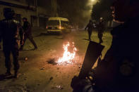 <p>Riot police patrol in the streets of Tebourba, south of the Tunisian capital, Tunis, during anti-government protests, Jan. 9, 2018. (Photo: Amine Landoulsi/AP) </p>