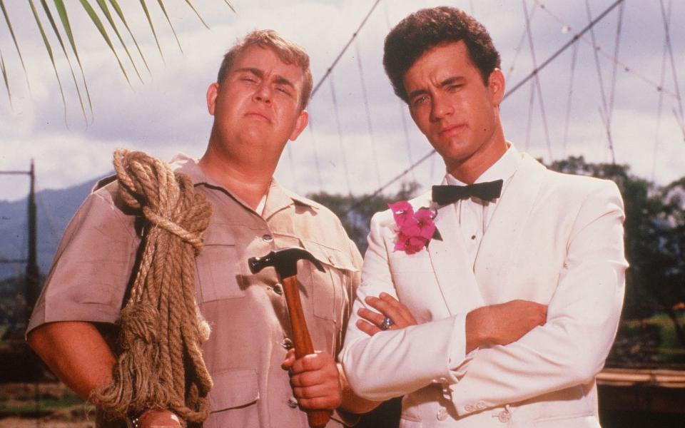 Das waren die Wilden 80-er, Baby - und Tom Hanks (Bild rechts, mit John Candy) war mittendrin: Ebenfalls 1984 betrank sich der angehende Superstar in der Blödel-Komödie "Bachelor Party" maßlos - angestiftet von seinen "Freunden", die seine Treue zur Verlobten testen wollen. (Bild: Hulton Archive/Getty Images)