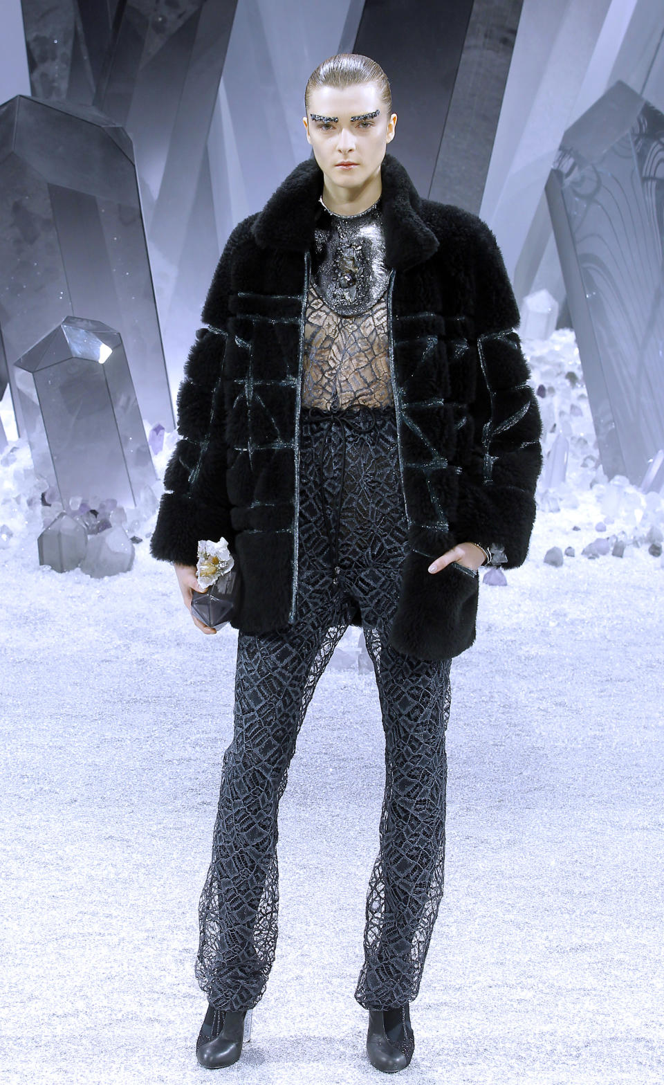 A model wears a creation by German Fashion designer Karl Lagerfeld as part of the Chanel presentation for Women's Fall-Winter, ready-to-wear 2013 fashion collection, during Paris Fashion week, Tuesday, March 6, 2012. (AP Photo/Jacques Brinon)