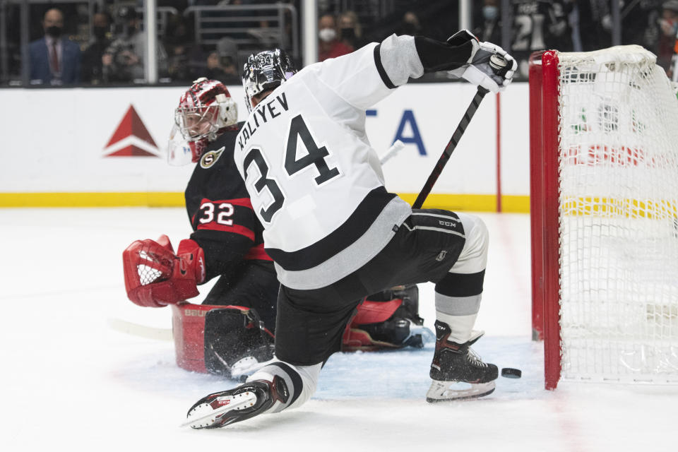 Los Angeles Kings left wing Arthur Kaliyev (34) scores past Ottawa Senators goaltender Filip Gustavsson (32) in the second period of an NHL hockey game Saturday, Nov. 27, 2021, in Los Angeles. (AP Photo/Kyusung Gong)