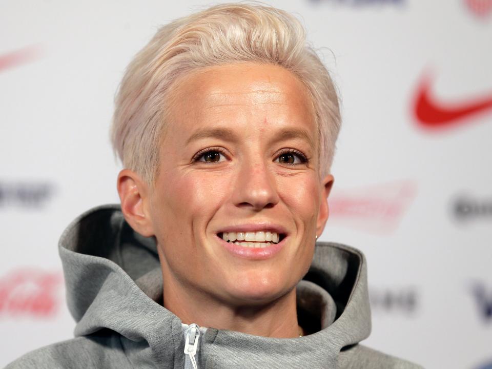 FILE - In this May 24, 2019, file photo, Megan Rapinoe, a member of the United States women's national soccer team, speaks to reporters during a news conference in New York. Seahawks quarterback Russell Wilson, soccer star Megan Rapinoe and three-time WNBA champion Sue Bird will preside over The ESPYS two-hour broadcast airing June 21 on ESPN. All three live in the Seattle area. Rapinoe and Bird are partners who share a household, which conveniently eases some logistics. Wilson’s singer-wife, Ciara, is likely to make an appearance, too.  (AP Photo/Seth Wenig, File)