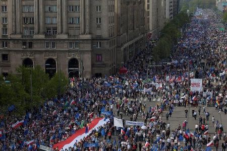 People hold a giant Polish flag at an anti-government demonstration called "March of Freedom" organised by opposition parties in Warsaw, Poland May 6, 2017. Agencja Gazeta/Dawid Zuchowicz via REUTERS