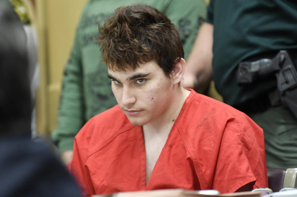 FILE - In this April 27, 2018 file photo, Florida school shooting suspect Nikolas Cruz, looks up while in court for a hearing in Fort Lauderdale, Fla. Attorneys for Cruz want a judge to prevent release of details of his education records to guarantee a fair trial. (Taimy Alvarez/South Florida Sun-Sentinel via AP, Pool, File)