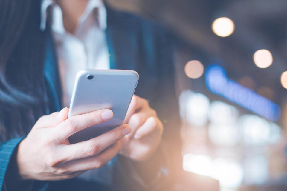 Person using a smartphone in public.