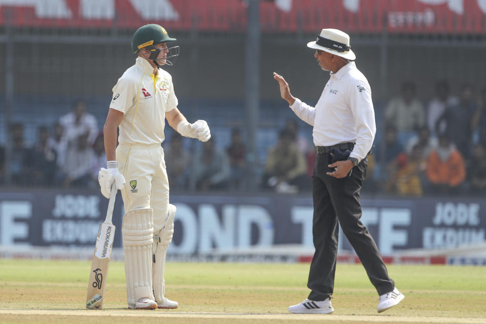 Australia's Marnus Labuschagn, left, chats with umpire during the third day of third cricket test match between India and Australia in Indore, India, Friday, March 3, 2023. (AP Photo/Surjeet Yadav)