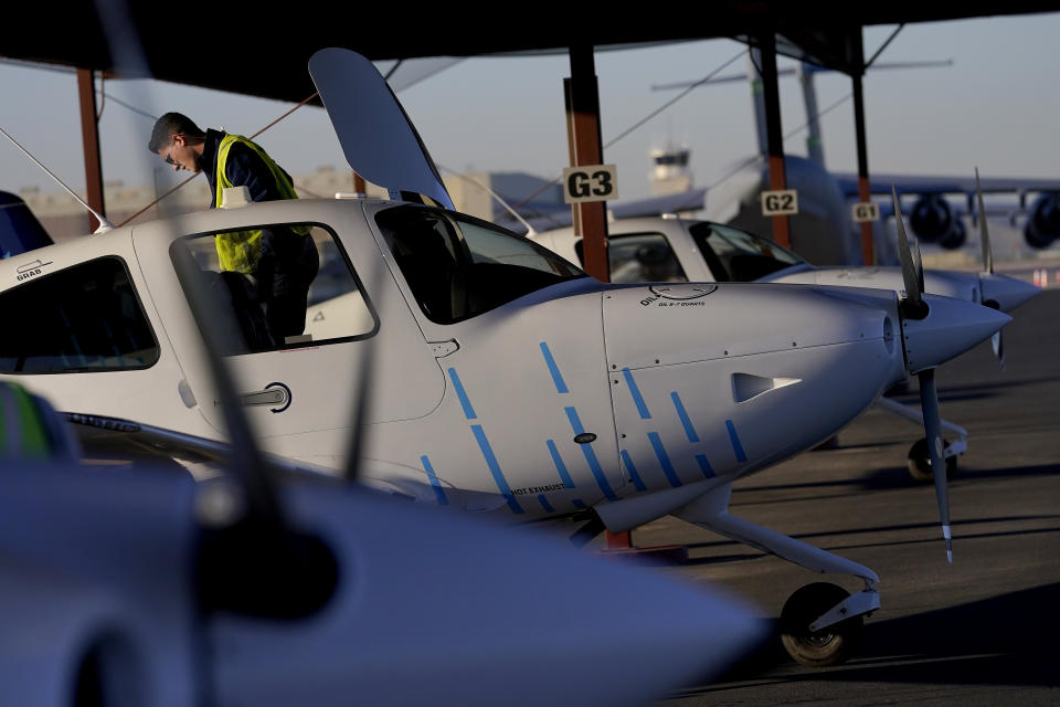 A United Aviate Academy student pilot inspects his aircraft prior to a flight, Friday, Oct. 28, 2022, in Goodyear, Ariz. Pilot training programs are being created though airline executives warn that it could take years to produce enough pilots to meet Americans' growing desire to travel. (AP Photo/Matt York)