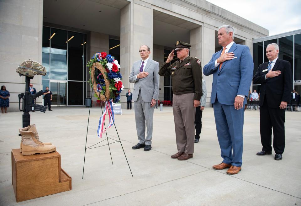 Maj. Gen. Janson D. Boyles (middle) leads the recognition of Maj. Gen. Al Hopkins during the Veterans Day ceremony at Two Mississippi Museums in Jackson on Thursday, Nov 9.