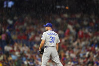Los Angeles Dodgers starting pitcher Max Scherzer stands in the rain during the fourth inning of a baseball game against the Philadelphia Phillies, Tuesday, Aug. 10, 2021, in Philadelphia. (AP Photo/Matt Slocum)