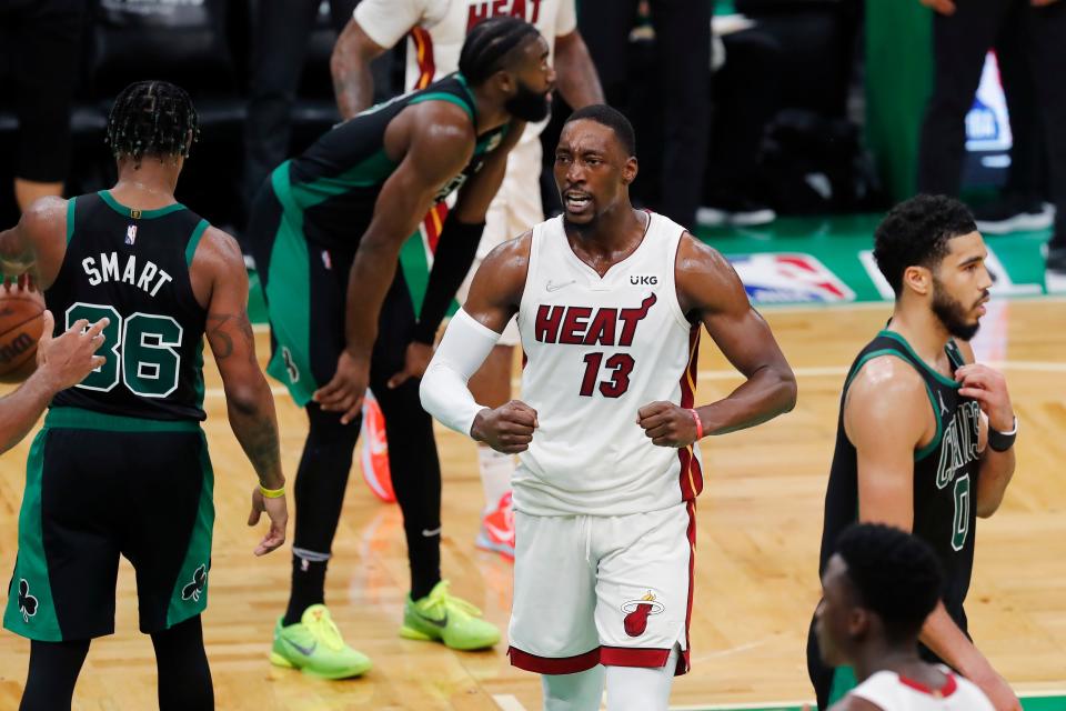 Miami Heat's Bam Adebayo (13) celebrates during the second half of Game 6 of the NBA basketball Eastern Conference finals playoff series against the Boston Celtics, Friday, May 27, 2022, in Boston. The Heat won 111-103. (AP Photo/Michael Dwyer)